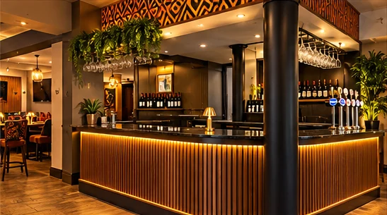 Cocktail bar concept with glowing gold lighting and rich wood